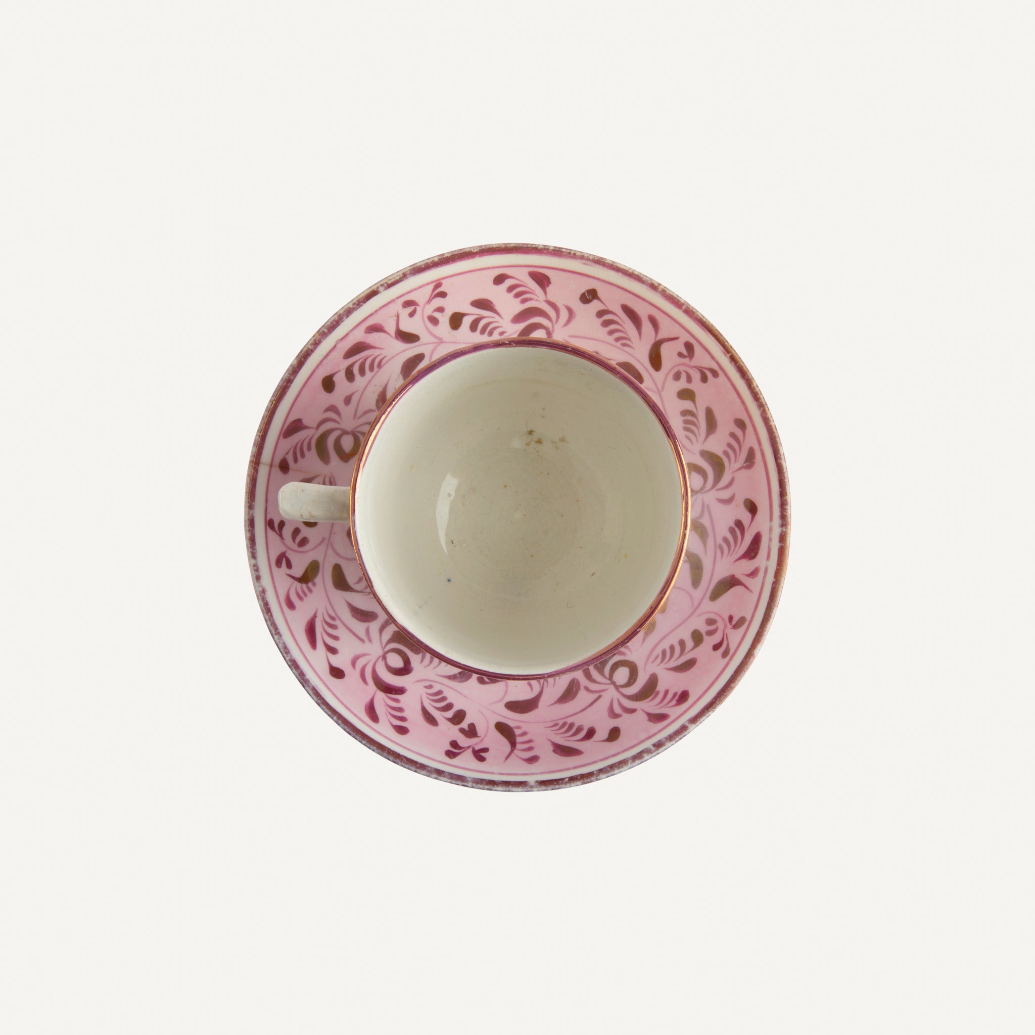 ANTIQUE LUSTREWARE CUP AND SAUCER